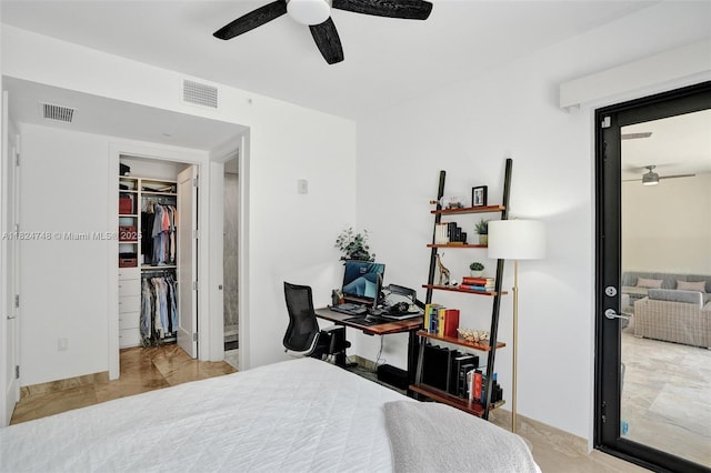 718 Valencia Ave Unit 204, Coral Gables, FL 33134 - bedroom with an office area, a walk in closet, a ceiling fan, ensuite bathroom, and a closet