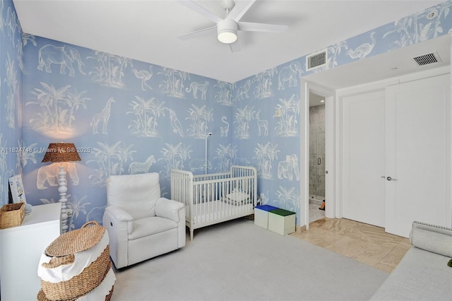 718 Valencia Ave Unit 204, Coral Gables, FL 33134 - bedroom with wallpapered walls, ceiling fan, and a nursery area