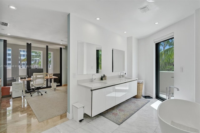 718 Valencia Ave Unit 204, Coral Gables, FL 33134 - bathroom with a soaking tub, double vanity, and recessed lighting
