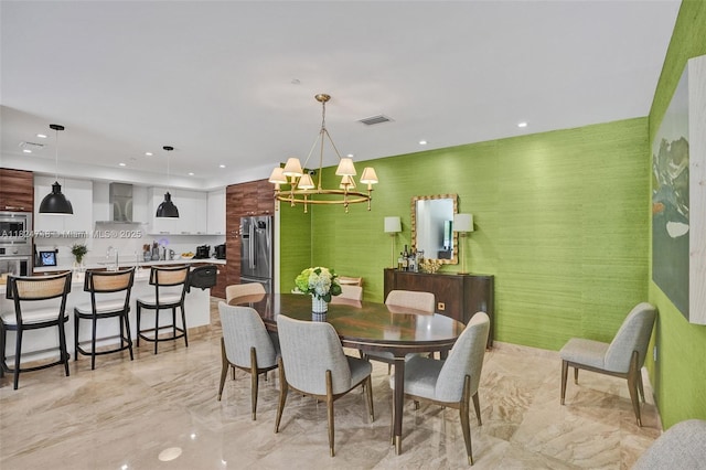 718 Valencia Ave Unit 204, Coral Gables, FL 33134 - dining area featuring light marble finish floors, a chandelier, and recessed lighting