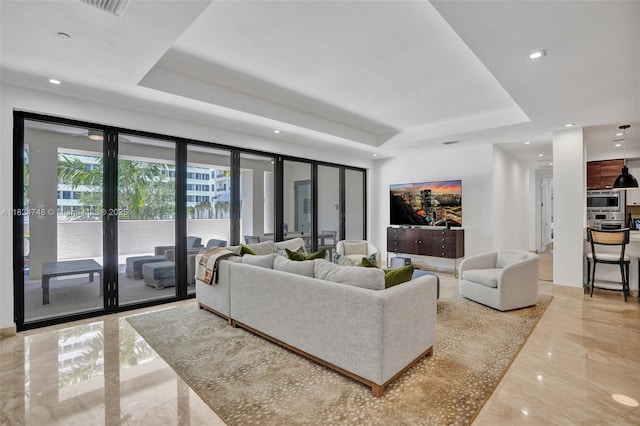 718 Valencia Ave Unit 204, Coral Gables, FL 33134 - living room featuring a raised ceiling, light marble finish flooring, french doors, and recessed lighting
