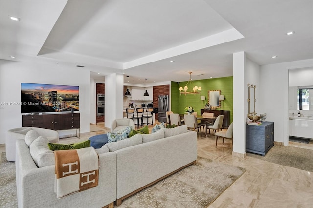 718 Valencia Ave Unit 204, Coral Gables, FL 33134 - living area featuring a raised ceiling, a chandelier, light marble finish floors, and recessed lighting