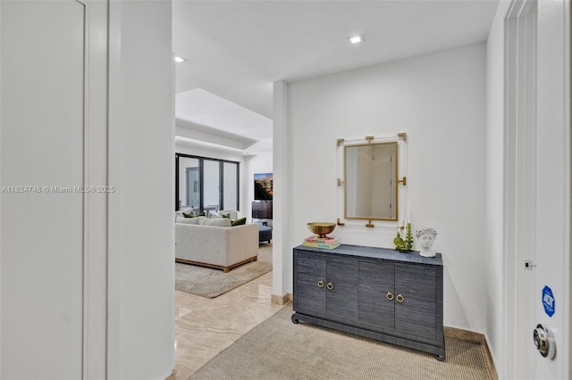 718 Valencia Ave Unit 204, Coral Gables, FL 33134 - corridor with light marble finish floors and recessed lighting