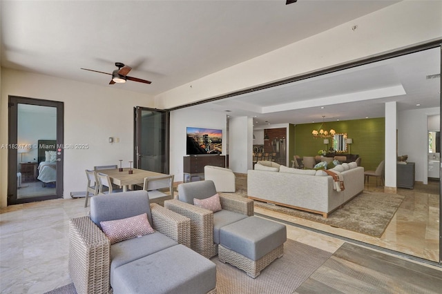 718 Valencia Ave Unit 204, Coral Gables, FL 33134 - living room with a chandelier, a ceiling fan, and light marble finish floors