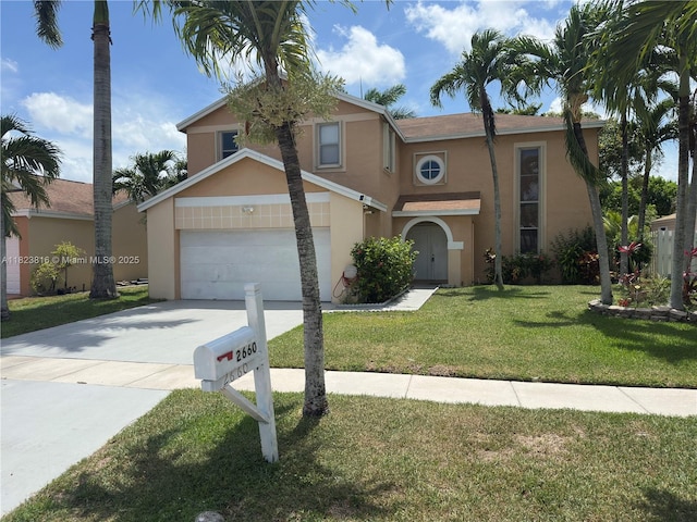 2660 Huron Way, Miramar, FL 33025 - view of front facade with stucco siding, driveway, a front yard, and an attached garage