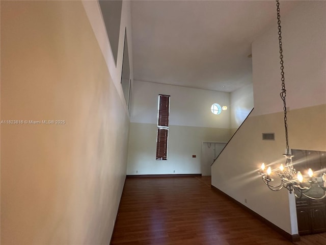 2660 Huron Way, Miramar, FL 33025 - hallway with a towering ceiling, wood finished floors, and a chandelier