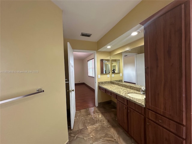 2660 Huron Way, Miramar, FL 33025 - bathroom with marble look tiles, vanity, and recessed lighting