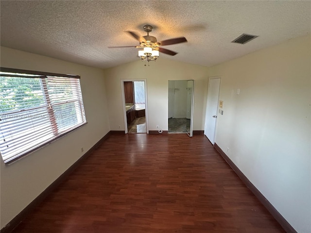 2660 Huron Way, Miramar, FL 33025 - spare room with a ceiling fan, dark wood finished floors, vaulted ceiling, and a textured ceiling