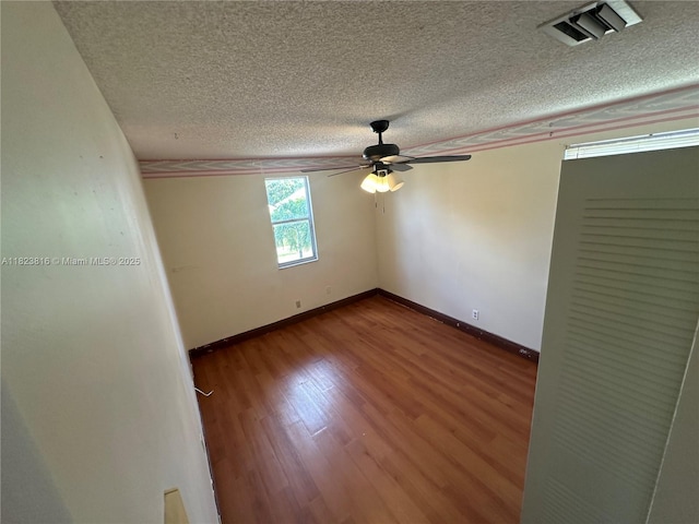 2660 Huron Way, Miramar, FL 33025 - spare room with a ceiling fan, a textured ceiling, and wood finished floors