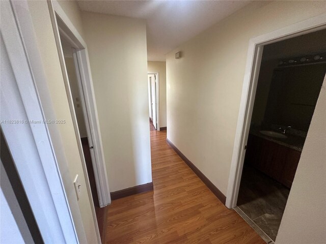 2660 Huron Way, Miramar, FL 33025 - hallway featuring light wood finished floors and baseboards