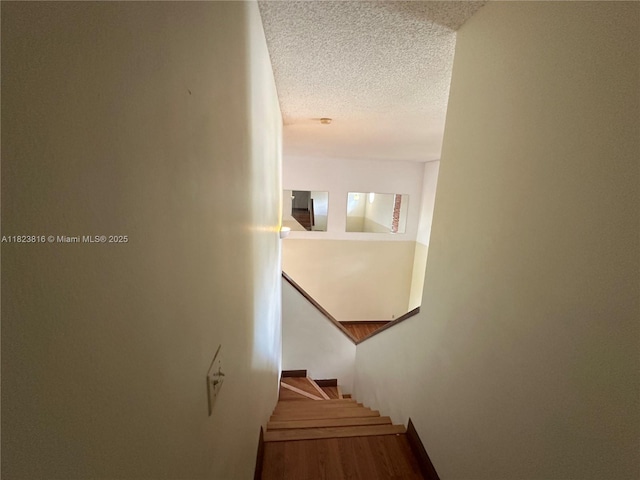 2660 Huron Way, Miramar, FL 33025 - stairs with a textured ceiling and wood finished floors