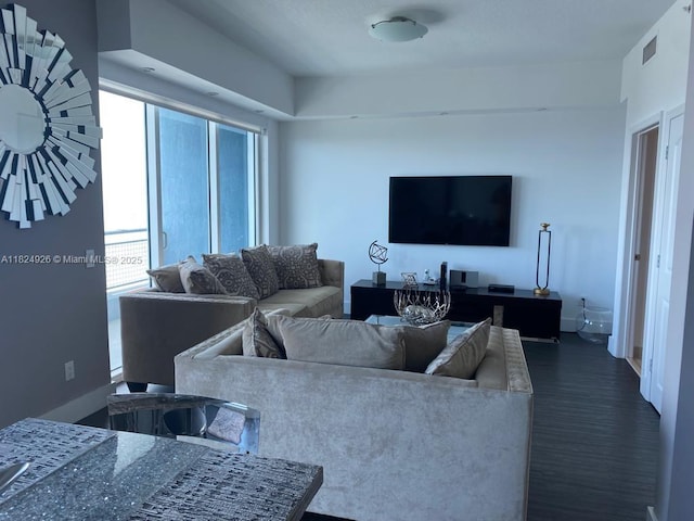 60 SW 13th St Unit 4607, Miami, FL 33130 - living room featuring dark wood-style flooring and baseboards