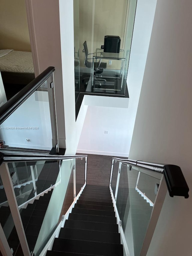 60 SW 13th St Unit 4607, Miami, FL 33130 - stairway featuring wood finished floors and baseboards