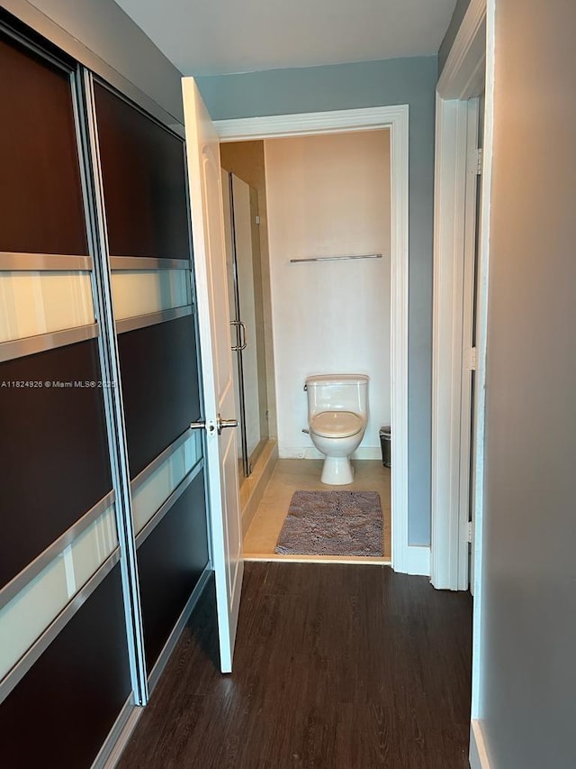60 SW 13th St Unit 4607, Miami, FL 33130 - full bathroom featuring wood finished floors and a shower with shower door
