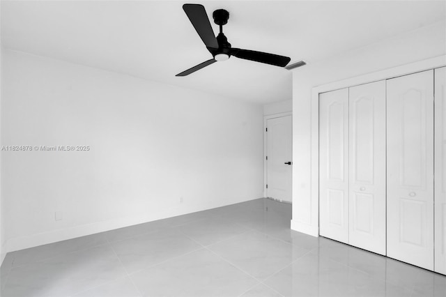 7441 NW 38th Ct, Lauderhill, FL 33319 - unfurnished bedroom featuring a closet, tile patterned floors, and a ceiling fan