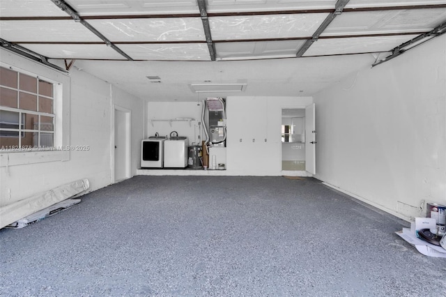7441 NW 38th Ct, Lauderhill, FL 33319 - garage featuring washer and dryer and heating unit