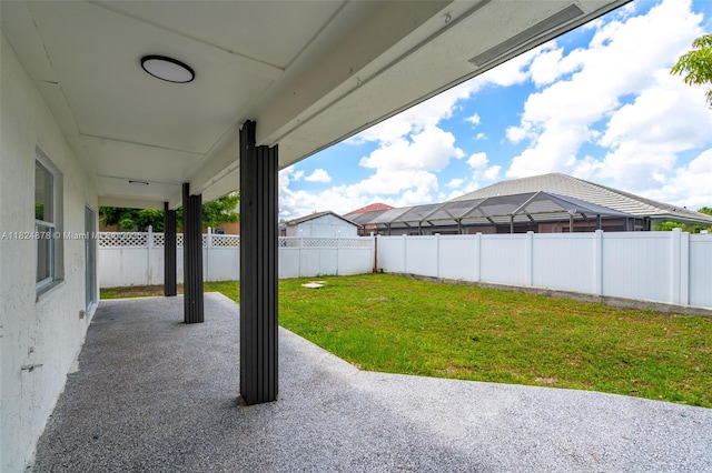 7441 NW 38th Ct, Lauderhill, FL 33319 - fenced backyard featuring a patio area