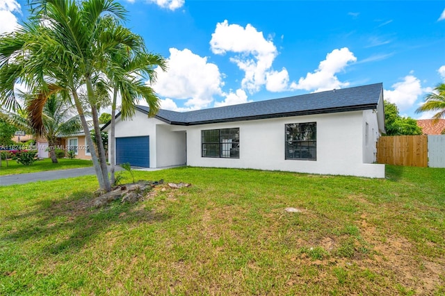 7441 NW 38th Ct, Lauderhill, FL 33319 - ranch-style house featuring an attached garage, stucco siding, and driveway