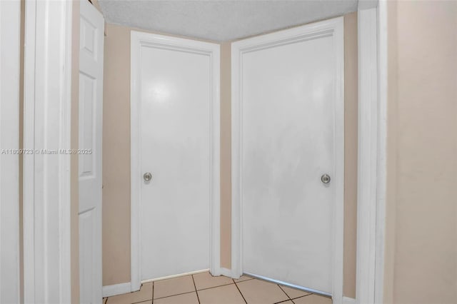 8317 Royal Palm Blvd Unit 104, Coral Springs, FL 33065 - hall with light tile patterned flooring and baseboards