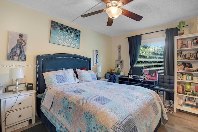 8317 Royal Palm Blvd Unit 104, Coral Springs, FL 33065 - bedroom with wood finished floors, a ceiling fan, and a textured ceiling