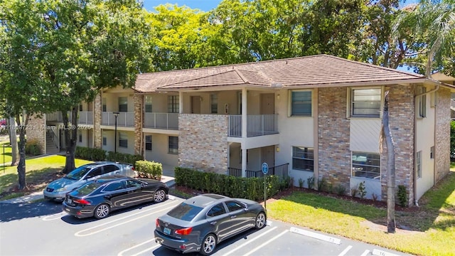 8317 Royal Palm Blvd Unit 104, Coral Springs, FL 33065 - view of building exterior with uncovered parking