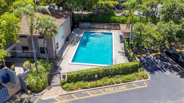 8317 Royal Palm Blvd Unit 104, Coral Springs, FL 33065 - community pool featuring a gate