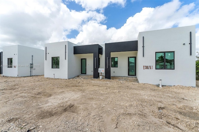 12389 SW 220th St, Miami, FL 33170 - rear view of house featuring stucco siding