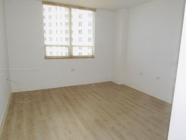801 Brickell Key Blvd Unit 807, Miami, FL 33131 - unfurnished room featuring wood finished floors