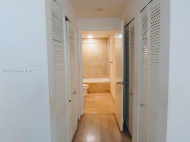 801 Brickell Key Blvd Unit 807, Miami, FL 33131 - hallway with light wood-style floors