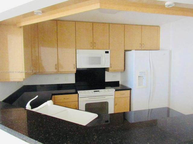801 Brickell Key Blvd Unit 807, Miami, FL 33131 - kitchen with white appliances, dark stone countertops, and light brown cabinets