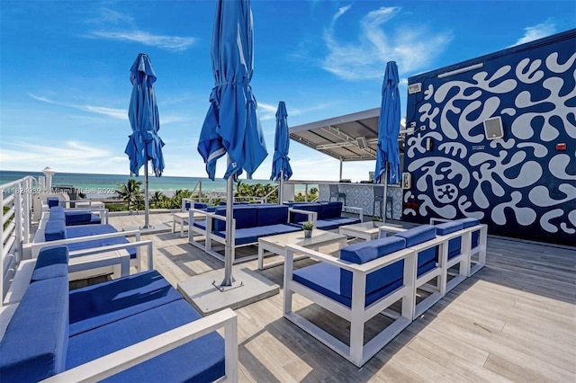 1024 Ocean Dr Unit A202, Miami Beach, FL 33139 - wooden terrace featuring an outdoor living space and view of water and beach