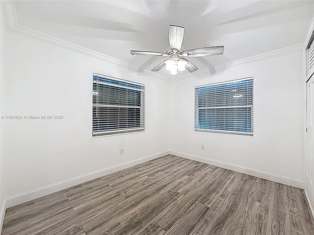 6464 Mcclellan St, Hollywood, FL 33024 - empty room featuring wood finished floors, ornamental molding, and ceiling fan