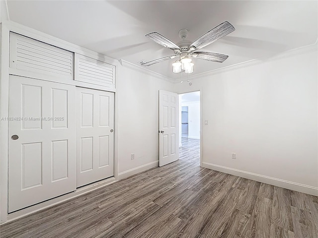 6464 Mcclellan St, Hollywood, FL 33024 - unfurnished bedroom with wood finished floors, crown molding, a closet, and ceiling fan