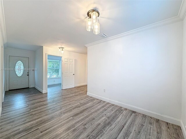6464 Mcclellan St, Hollywood, FL 33024 - unfurnished room featuring wood finished floors and crown molding