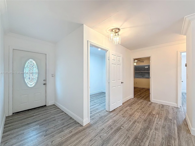 6464 Mcclellan St, Hollywood, FL 33024 - entrance foyer featuring wood finished floors and ornamental molding