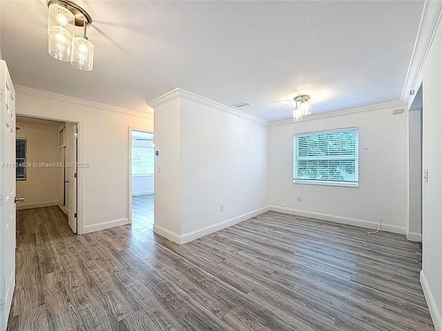 6464 Mcclellan St, Hollywood, FL 33024 - spare room with ornamental molding, healthy amount of natural light, and wood finished floors
