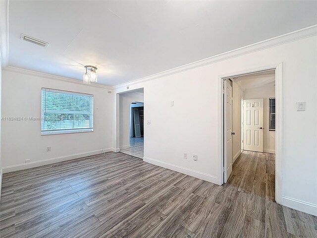 6464 Mcclellan St, Hollywood, FL 33024 - unfurnished room featuring ornamental molding and wood finished floors