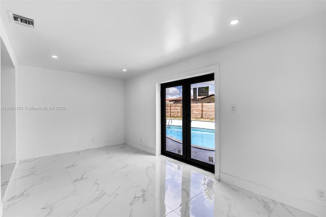 4660 W 8th Pl, Hialeah, FL 33012 - unfurnished room featuring recessed lighting and light marble finish floors