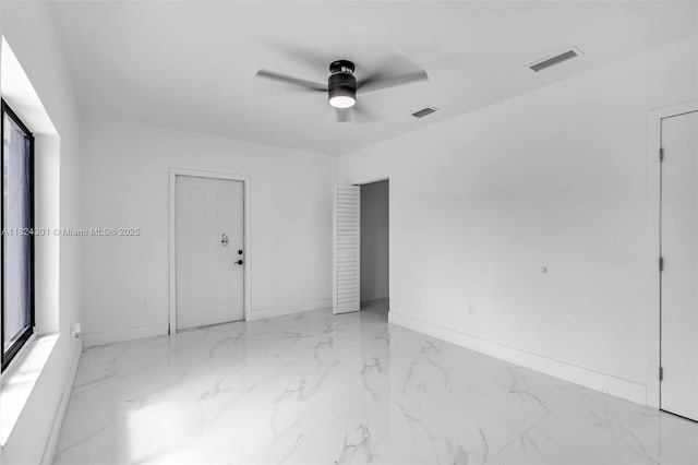 4660 W 8th Pl, Hialeah, FL 33012 - spare room with ceiling fan and marble finish flooring