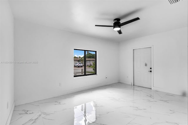 4660 W 8th Pl, Hialeah, FL 33012 - spare room featuring marble finish floors and a ceiling fan