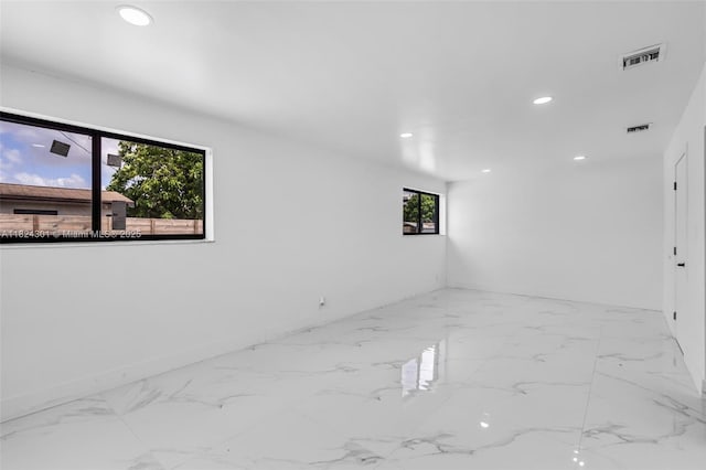 4660 W 8th Pl, Hialeah, FL 33012 - empty room with recessed lighting and marble finish floors