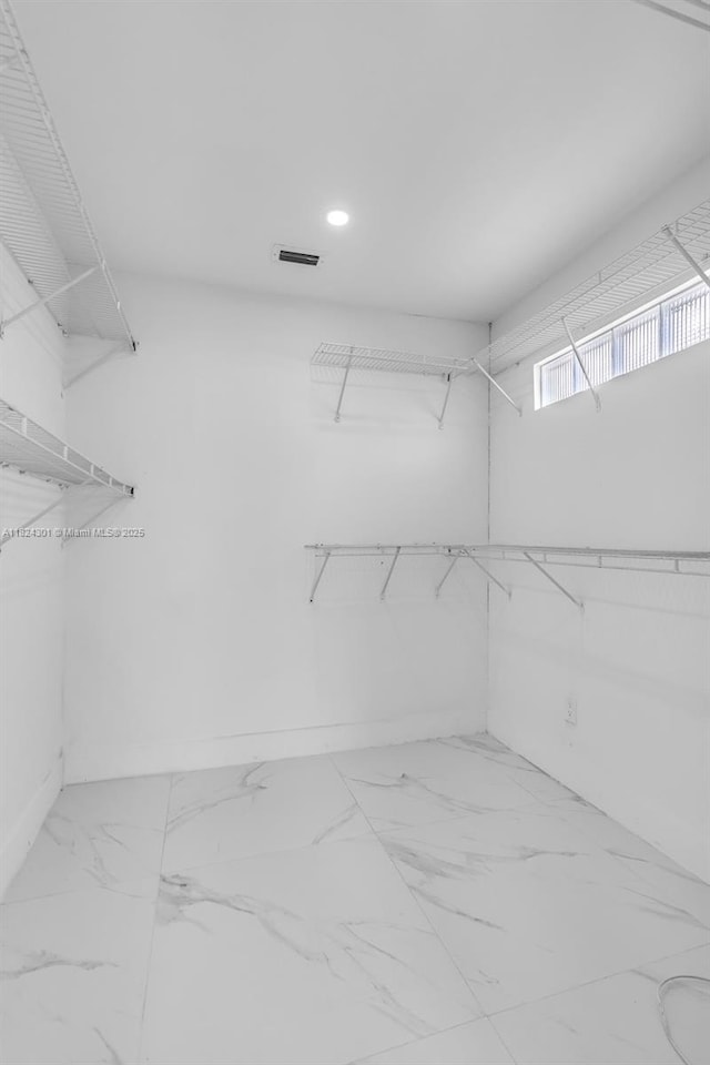 4660 W 8th Pl, Hialeah, FL 33012 - spacious closet featuring marble finish flooring