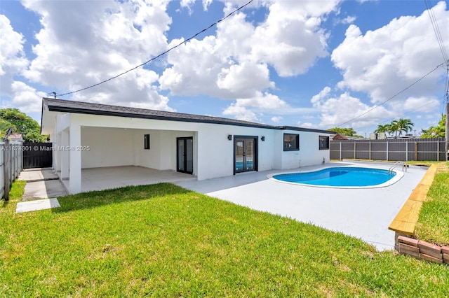 4660 W 8th Pl, Hialeah, FL 33012 - rear view of house featuring stucco siding, a patio, and french doors