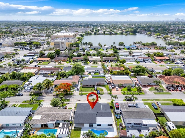 4660 W 8th Pl, Hialeah, FL 33012 - aerial perspective of suburban area with a large body of water and a pool area