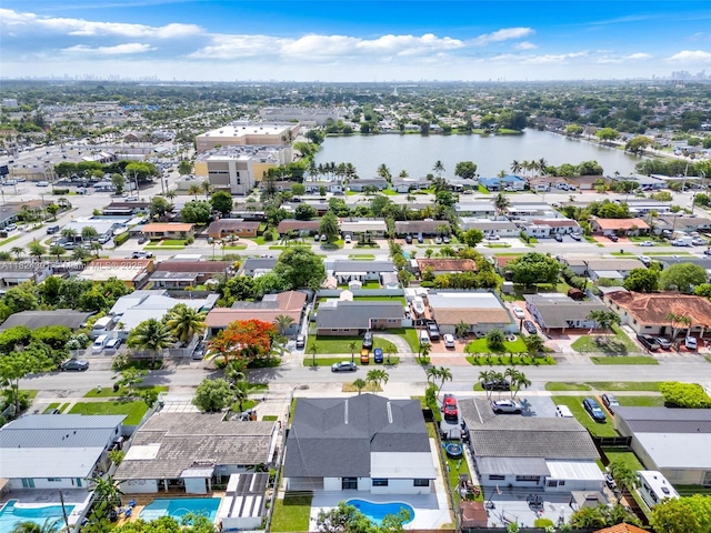 4660 W 8th Pl, Hialeah, FL 33012 - aerial perspective of suburban area featuring a nearby body of water and a pool area