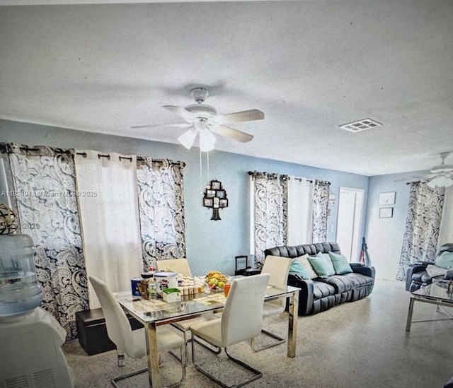 166 E 16th St, Hialeah, FL 33010 - dining room with a ceiling fan and a textured ceiling