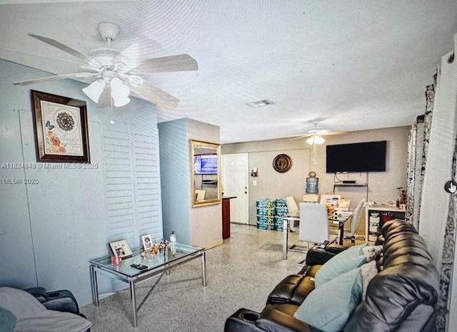 166 E 16th St, Hialeah, FL 33010 - living room featuring a ceiling fan and speckle patterned floor
