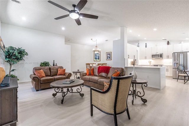 14295 NW 18th Pl, Pembroke Pines, FL 33028 - living area featuring light wood-style floors, ceiling fan, recessed lighting, a chandelier, and a textured ceiling