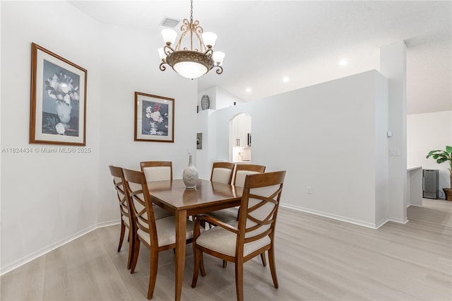 14295 NW 18th Pl, Pembroke Pines, FL 33028 - dining space with arched walkways, light wood-style floors, a chandelier, lofted ceiling, and recessed lighting