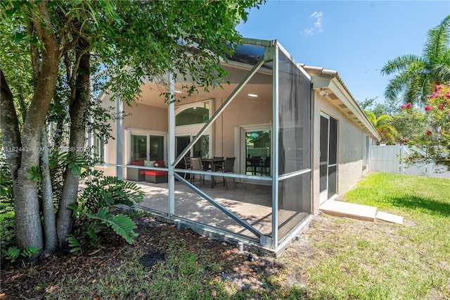 14295 NW 18th Pl, Pembroke Pines, FL 33028 - rear view of house featuring stucco siding and a patio area